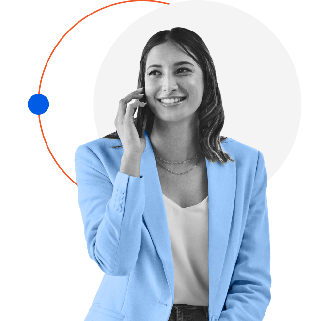 A woman in a blue blazer smiles while talking on a smartphone. She stands against a geometric background with a white circle and an orange arc intersecting, along with a small blue circle on the left.