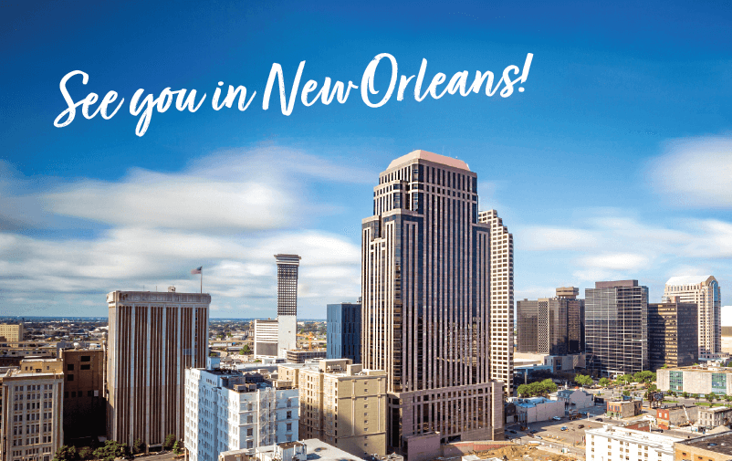 A skyline view of New Orleans with tall buildings under a clear blue sky. Text at the top reads, "See you in New Orleans!.