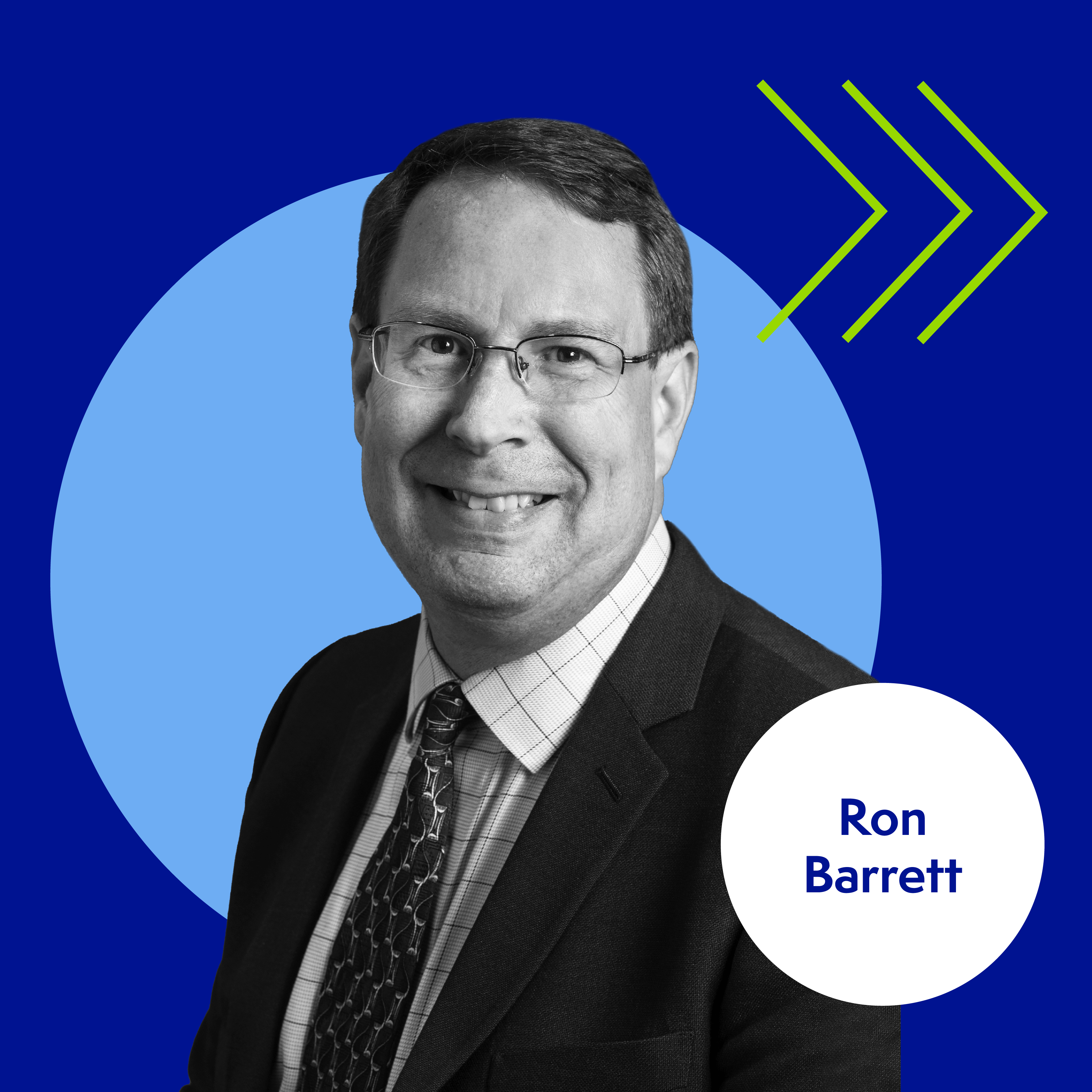 Man in a suit and tie with glasses smiles against a blue geometric background featuring two green arrows. A white circle in the corner contains the text "Ron Barrett.